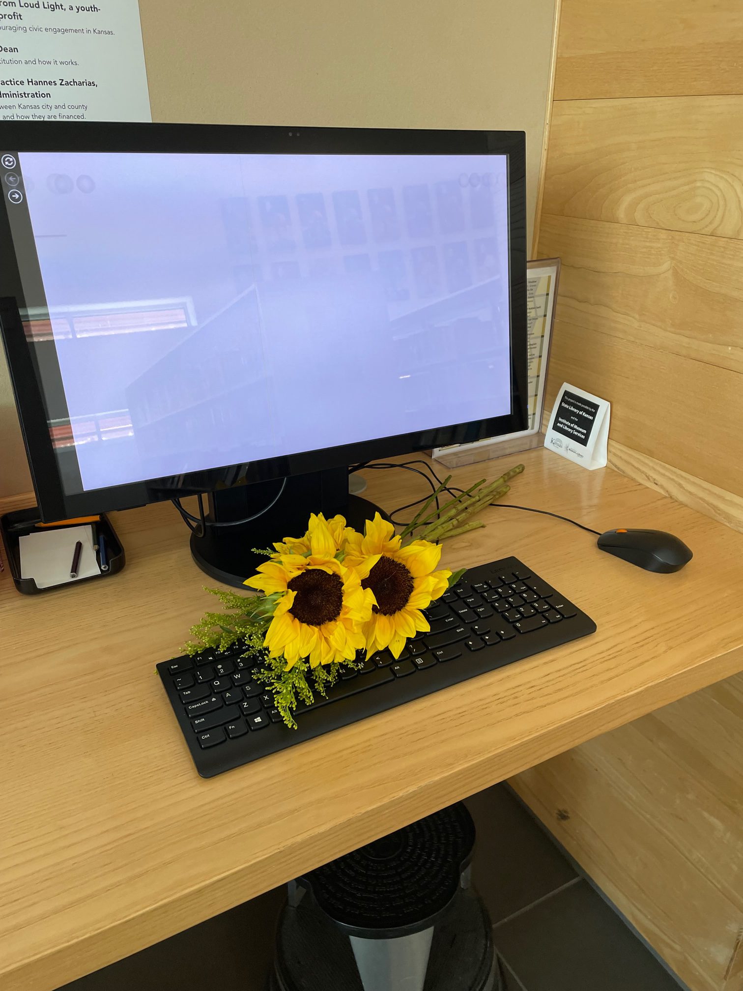 Library computer with sunflowers