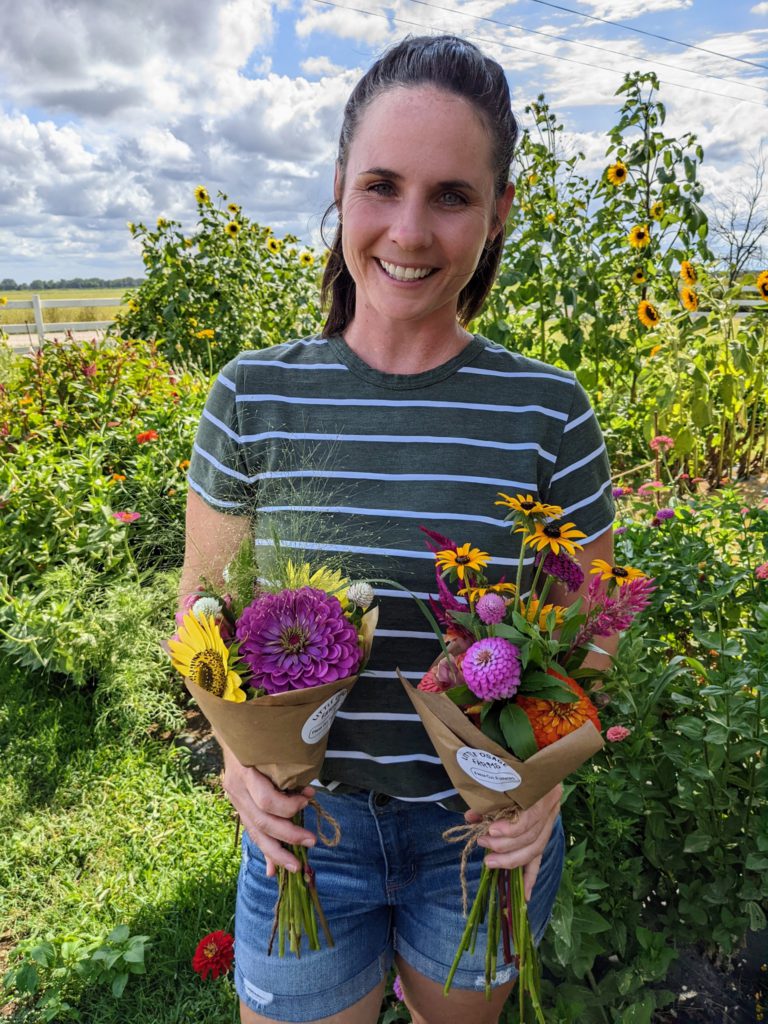 Anndrea Tholen holding flowers from her garden