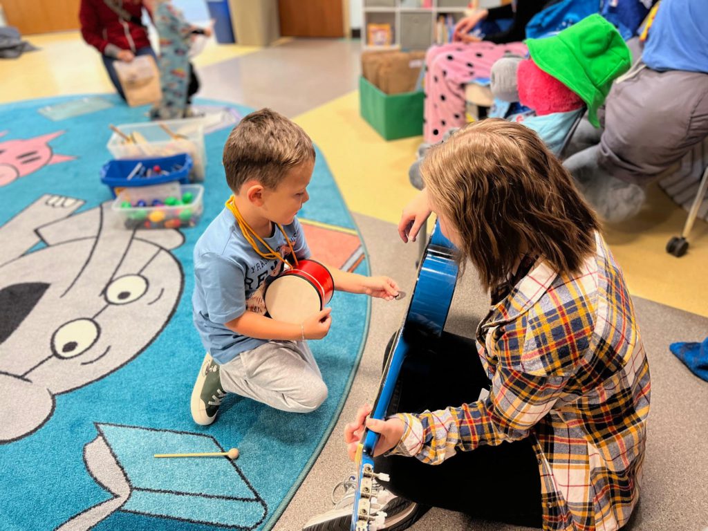 A child at the Bonner Springs Library playing on the floor of the children's area.